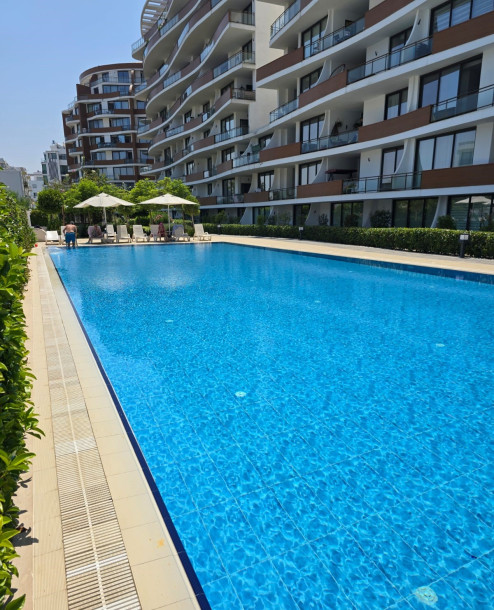 GİRNE/MERKEZDE HAVUZLU SİTEDE SATILIK 2+1 DAİRE-1