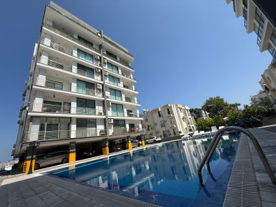 GİRNE MERKEZ ÖĞRETMENLER EVİ BÖLGESİNDE HAVUZLU SİTEDE KİRALIK 2+1 EŞYALI DAİRE